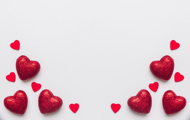 Stock photo of red hearts on a white background with a space for text