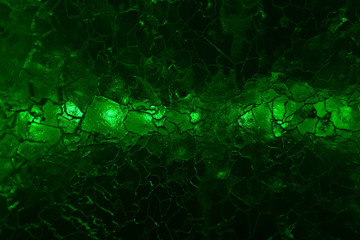 abstract dark green background - glow through cracked ice