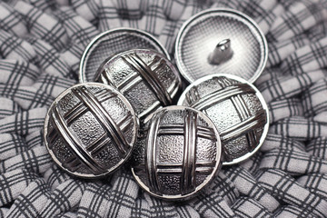 metal buttons are on a gray background. retro background. atelier and sewing concept. close up