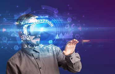 Businessman looking through Virtual Reality glasses with DECRYPTION inscription, innovative technology concept