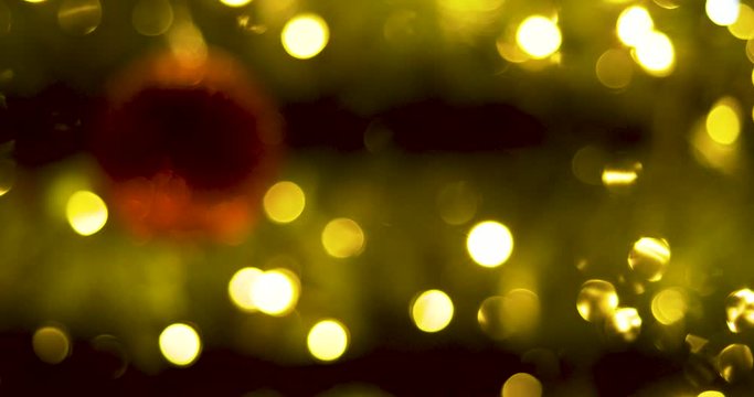 Defocused lights of Christmas tree. Christmas background with bright decorations