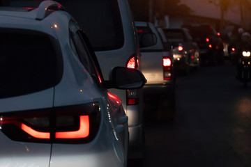 Blurred image of cars on the road with light break at in evening.