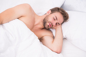 problems with changing time. good morning. Good nap. Time to rest. male health and bachelor lifestyle. Relaxing in bedroom. energy and tiredness. sexy man sleep in bed. Impossible to wake up