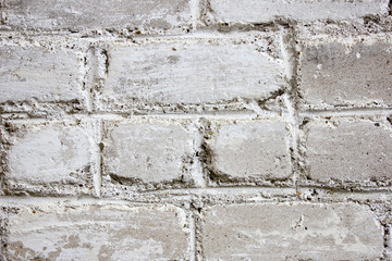 White brick wall. The texture of the old brick. Old masonry. Background.