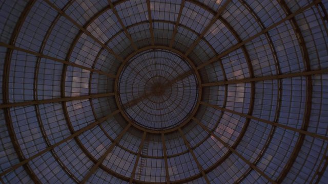 Right to left pan real time medium shot of a gallery Vittorio Emanuele II, Milan, Italy. It is Italy oldest mall in Milan. Popular tourist attraction.