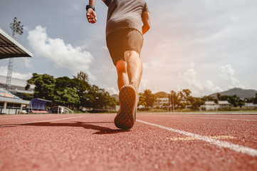 fitness, jogging, running, exercise, lifestyle and healthy concept. The young man wore all parts of...