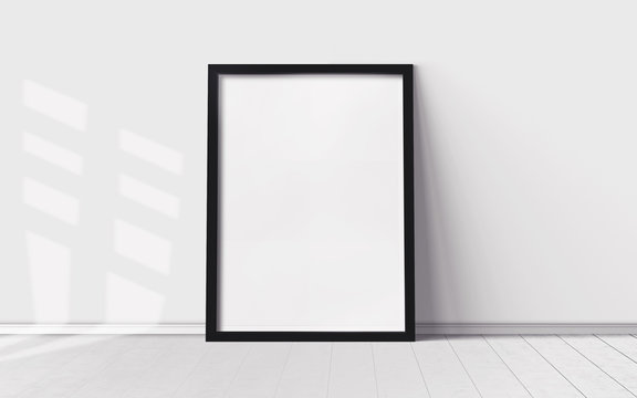 White poster with blank frame on wooden floor. Mockup for you design print.