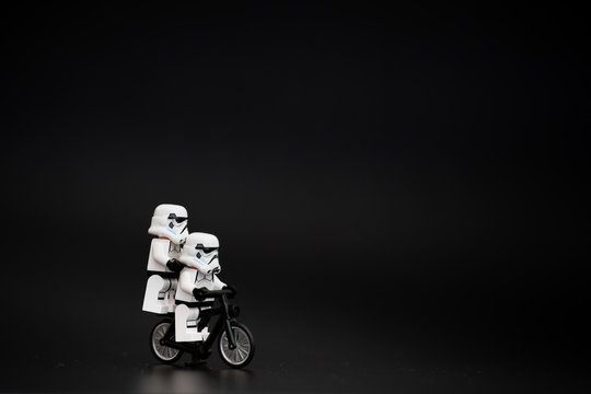 Orvieto, Italy - November 15th 2015: Star Wars Lego Stormtroopers minifigures on bicycle. Lego is a popular line of construction toys manufactured by the Lego Group