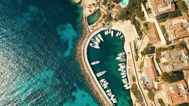 Aerial drone shot, Blue Lagoon island 4k travel video. Eye view on the sea coastline with pier and yacht at sunny day. Travel, journey, islands, Seascape, freedom, holidays concept