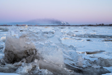 A large block of ice in close-up. Winter landscape of a frozen river.