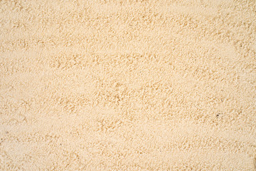 Fototapeta na wymiar Textured yellow sand background.
