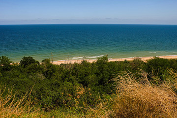 Sea horizon with steep slope coast..High cliff. Azov sea, Temryuk Bay, Peresyp.