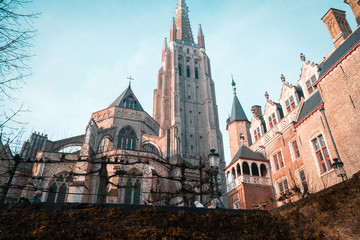 Fototapeta premium boat tour in Brugge Belgium.crossing the river and watching the buildings and the nature of the city