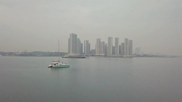 White Ship with Skyscraper View - Aerial View - Forwards 