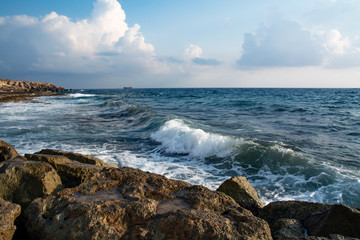 Fototapeta na wymiar Seascape waves with foam of the Mediterranean Sea