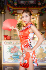 happy chinese new year.asian girls showing red envelopes for chinese new year.