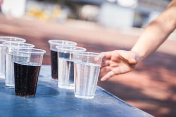 Human are catching a glass of water.
