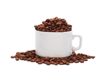 white coffee cup overfilled with roasted coffee beans isolated on white background