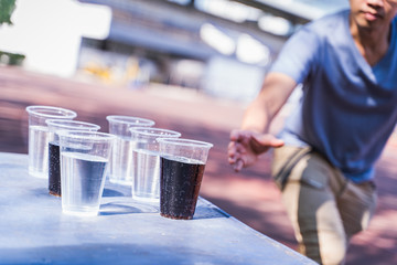 Human are catching a glass of water.