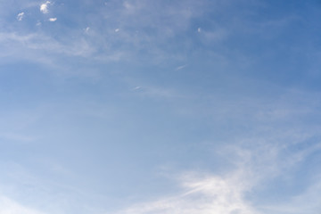 Tiny clouds against blue sky.