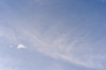 Tiny clouds against blue sky.