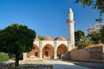 Fototapeta na wymiar Turkish Minaret and Mosque in the city of Rethymnon on the island of Crete..