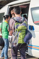 Back view of male young tourist with backpack travel by van or mini in Thailand. © phoderstock