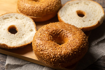 Sesame bagels on wooden background