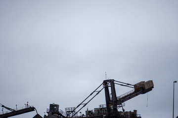 Fototapeta na wymiar Conveyer belt transporting manganese ore for shipment