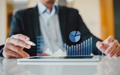 Businessman investment consultant analyzing company financial report balance statement working with...