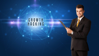 Businessman thinking about security solutions with GROWTH HACKING inscription