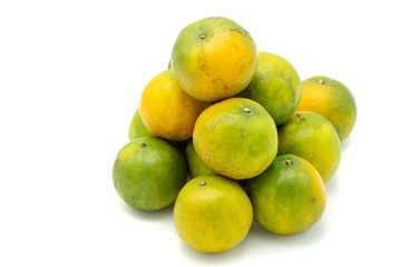 Pile oranges isolated on white background.