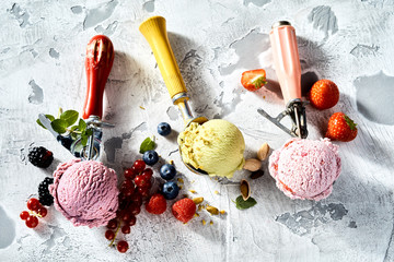 Assorted ice cream flavours in metal scoops
