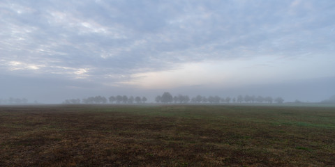 Scenic View Of Landscape Against Sky during Foggy Weather