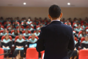 Speak on stage and talk at a meeting . Audience in the meeting room Business and entrepreneurship