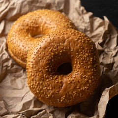 Sesame bagels on dark background