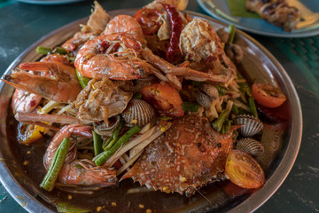 Fototapeta na wymiar spicy shrimps salad in metal plate.