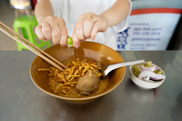 Curried Noodle Soup with Chicken on stainless table.