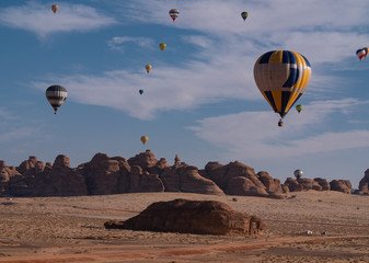 Winter at Tantora Hot Air Balloon Festival over Mada'in Saleh (Hegra) ancient site, Al Ula, Saudi Arabia