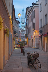 Modena - The asile of olt town with the cathedral tower.