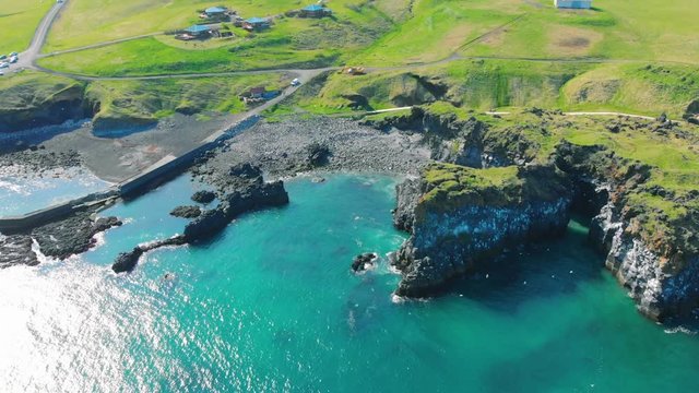 Beautiful landscape of Londrangar Cliffs on Snaefellsness, West Iceland. Top view footage of beautiful Icelandic nature in summer. Gull birds flying. Recorded at Hellnar View Point.