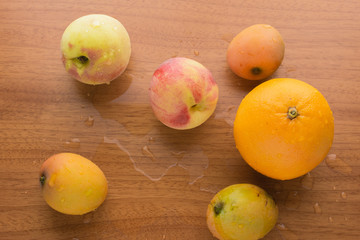 Wet orange, peaches and mangos