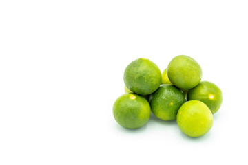 Pile of limes isolated on white background.