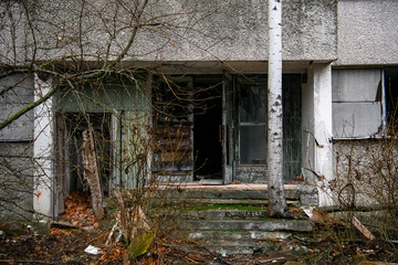 Abandoned ghost town Prypiat. Overgrown trees and collapsing buildings in Chornobyl exclusion zone....