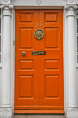 Orange colored door in Dublin
