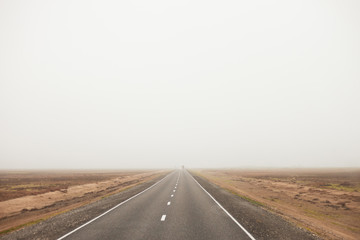 Smooth track with markings, in a field with clear sky.