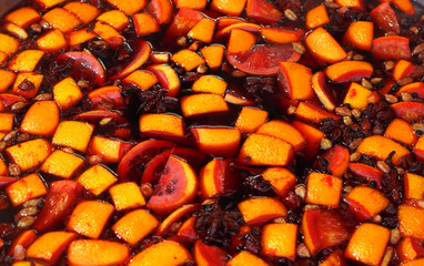 Mulled wine background texture. Mulled wine is cooked in a large pot.