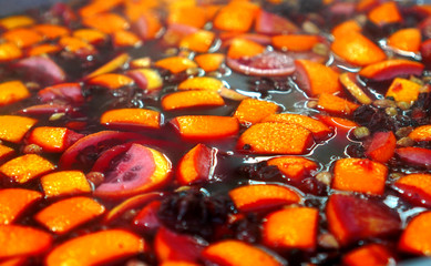 Mulled wine background texture. Mulled wine is cooked in a large pot.