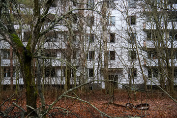 Abandoned ghost town Prypiat. Overgrown trees and collapsing buildings in Chornobyl exclusion zone....