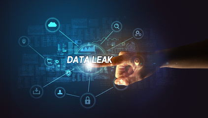 Hand touching DATA LEAK inscription, Cybersecurity concept